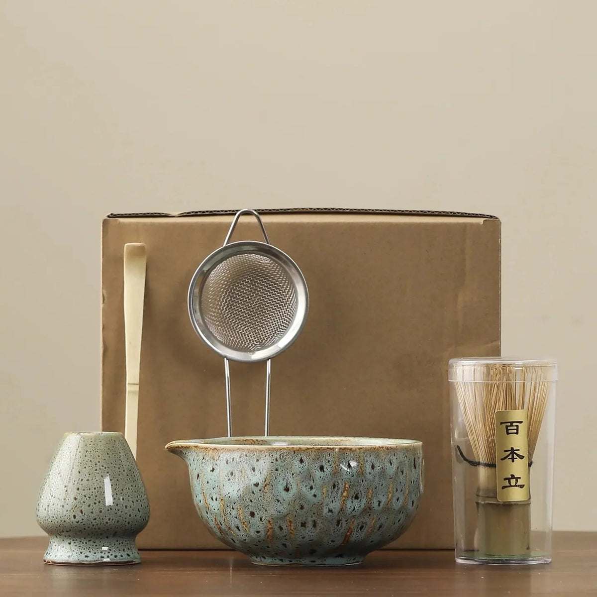 Blue matcha set: whisk stand, bamboo scoop, steel sifter, spouted ceramic bowl and bamboo whisk in its clear tube