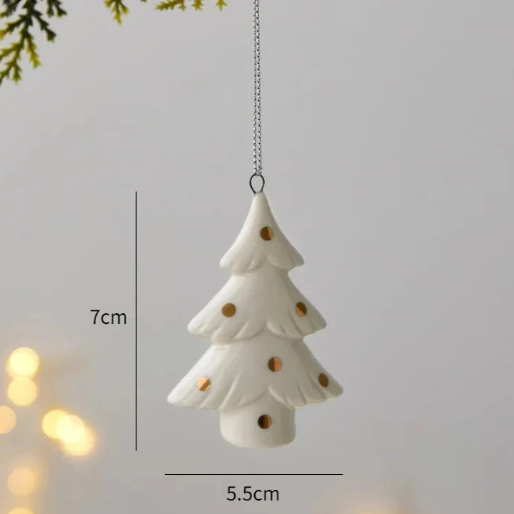 Polka Dot ornament with round gold dots hanging from its cord, marked 7 centimeters tall and 5.5 centimeters wide