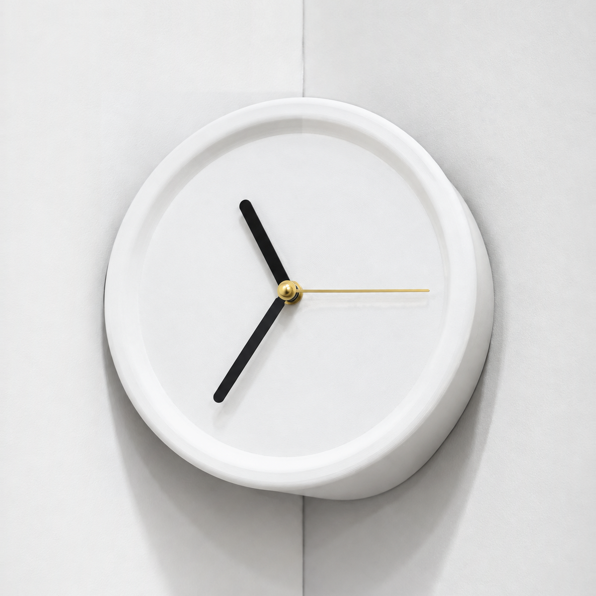 White corner wall clock in an inside wall corner, black hands and gold second hand