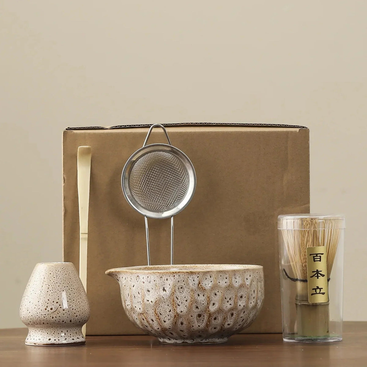 White matcha set: whisk stand, bamboo scoop, steel sifter, spouted ceramic bowl and bamboo whisk in its clear tube