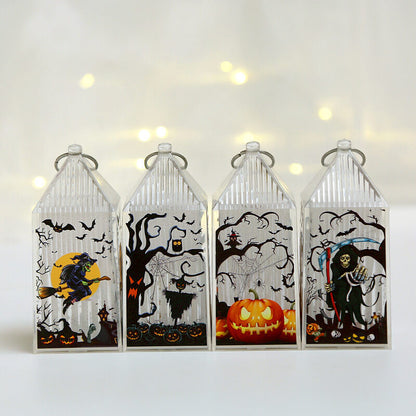 Four mini Halloween lanterns switched off, showing the printed witch, scarecrow, pumpkin and reaper scenes in color