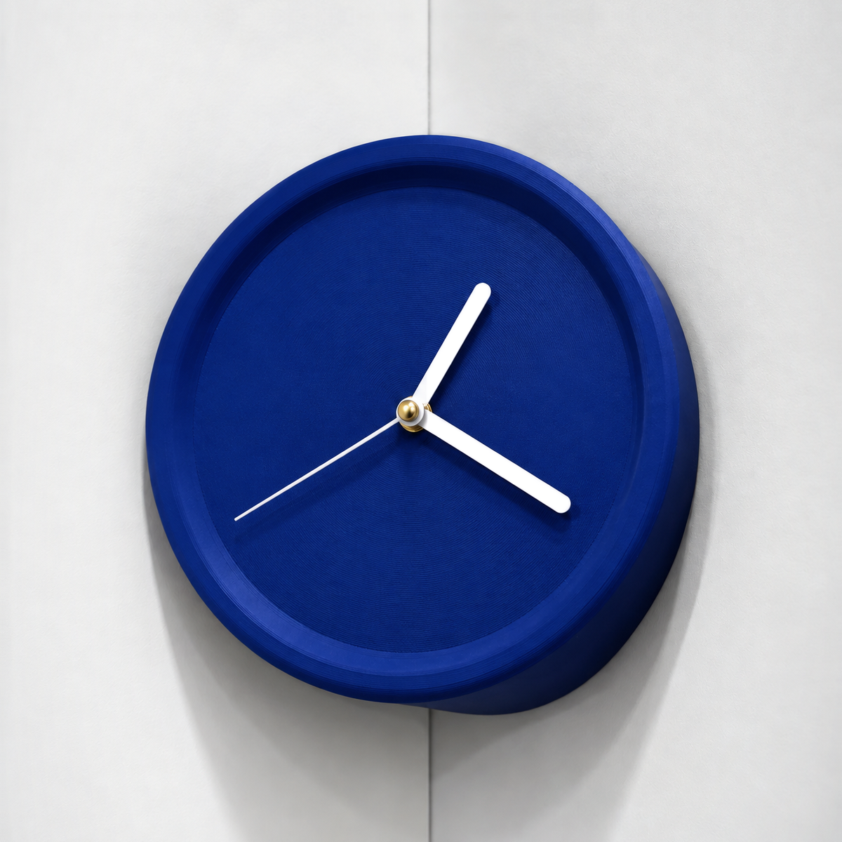 Blue corner wall clock in an inside wall corner, white hands