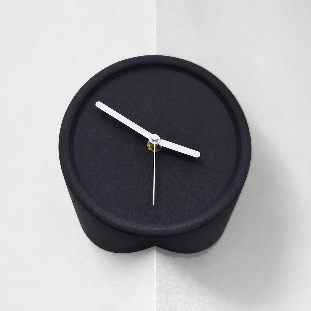 Black corner wall clock for outside corners, mounted on a wall edge, white hands