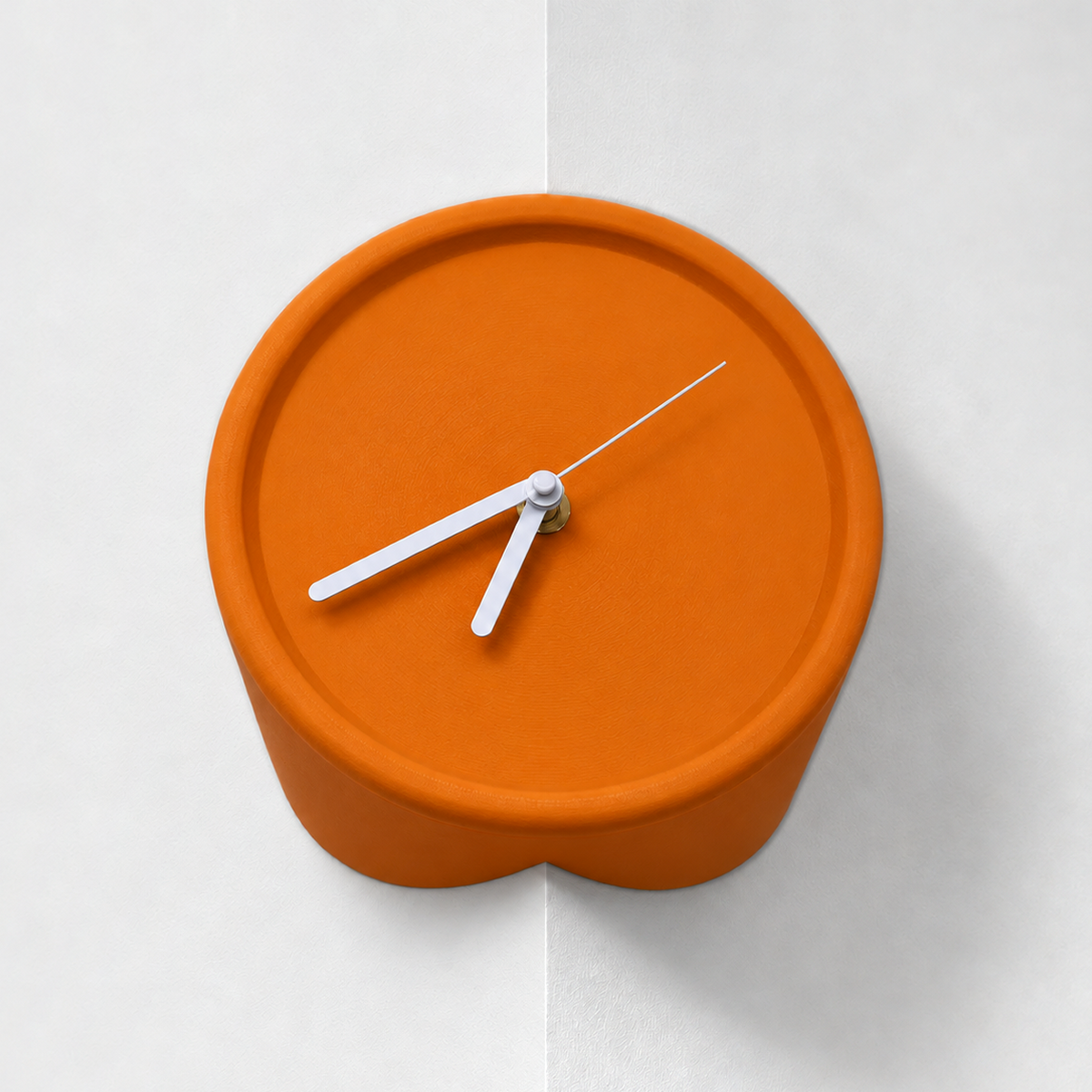 Orange corner wall clock for outside corners, mounted on a wall edge, white hands