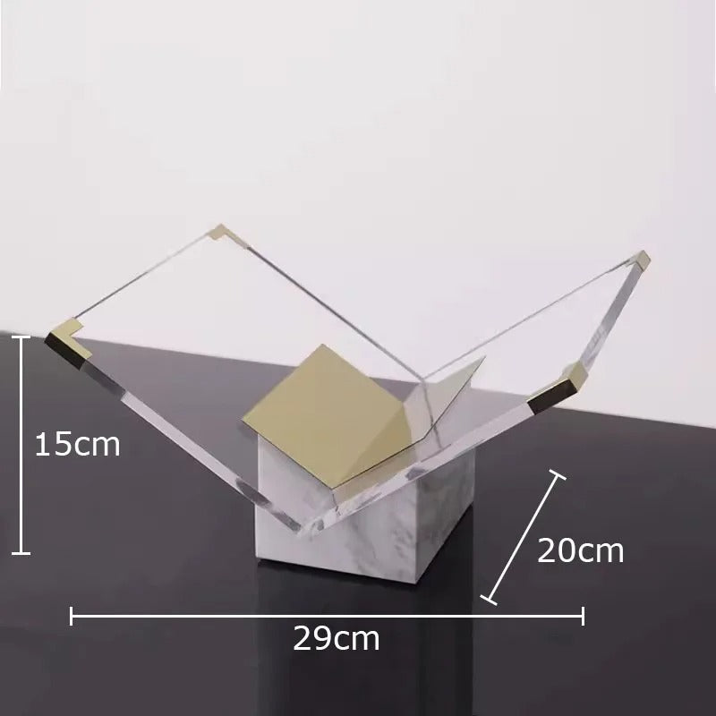 White and gold marble book stand with its dimensions marked, 29 cm wide, 20 cm deep and 15 cm tall