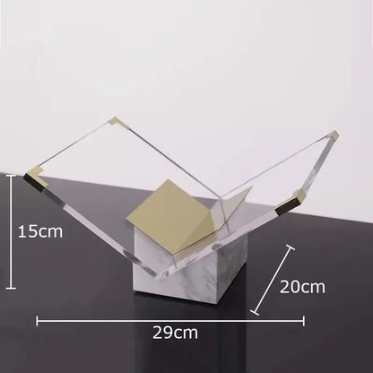 White and gold marble book stand with its dimensions marked, 29 cm wide, 20 cm deep and 15 cm tall