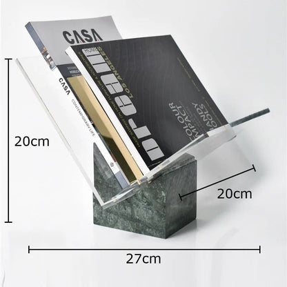 Green marble magazine holder holding two magazines, with measurement lines