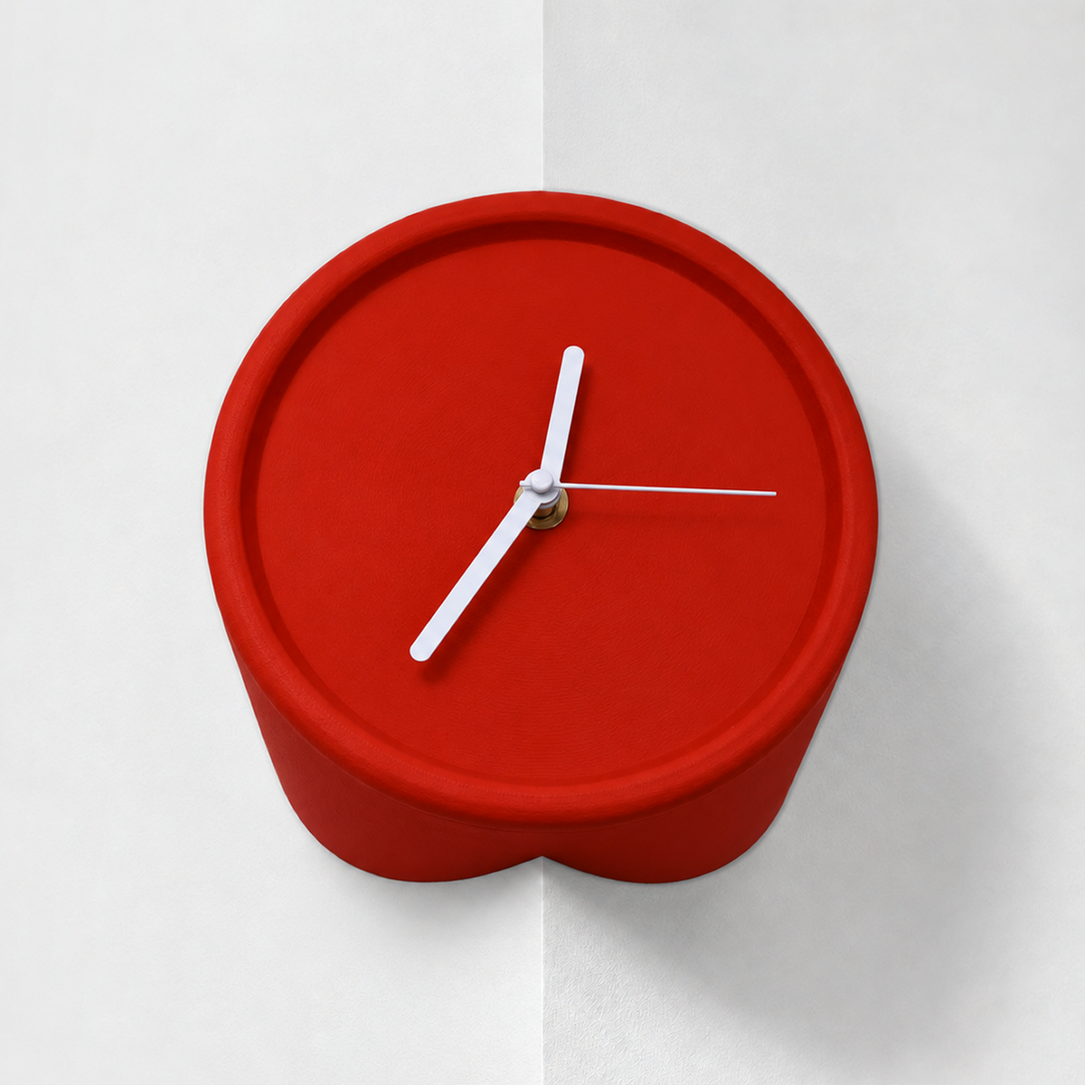 Red corner wall clock for outside corners, mounted on a wall edge, white hands