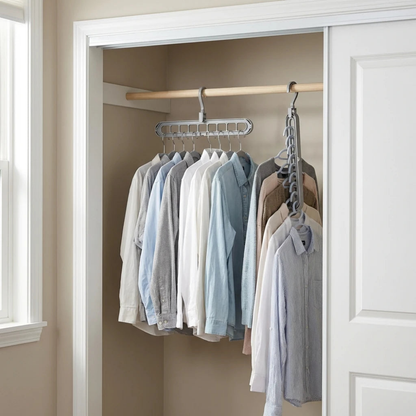 Two gray nine-slot hangers on one closet rail, the left one hanging level with nine shirts spread side by side and the right one turned vertical with garments stacked down it