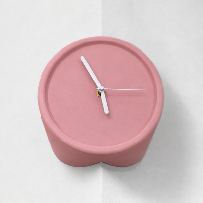 Pink corner wall clock for outside corners, mounted on a wall edge, white hands