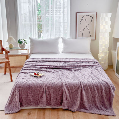 Purple embossed fleece blanket over a bed with a tray on top