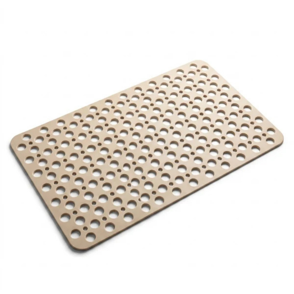 Beige non slip shower mat shown whole on a plain white background, with its rounded corners and its two sizes of drainage hole