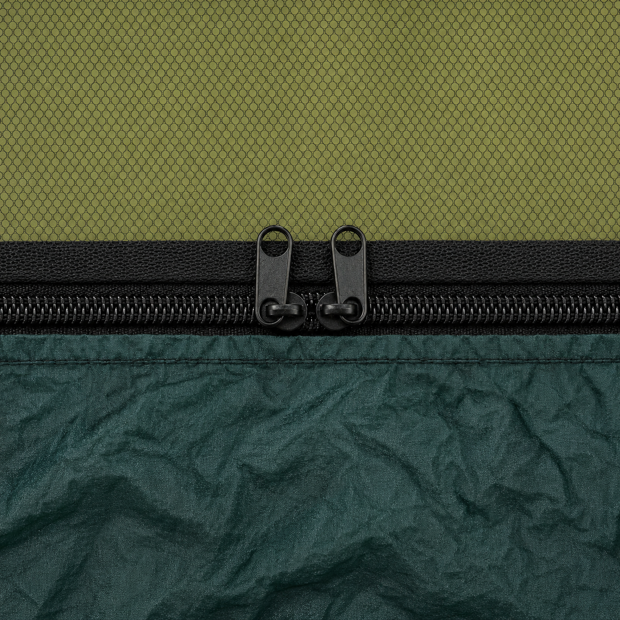Close-up of the zip joining the mosquito net to the hammock body, two pulls nose to nose