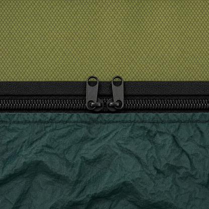 Close-up of the zip joining the mosquito net to the hammock body, two pulls nose to nose