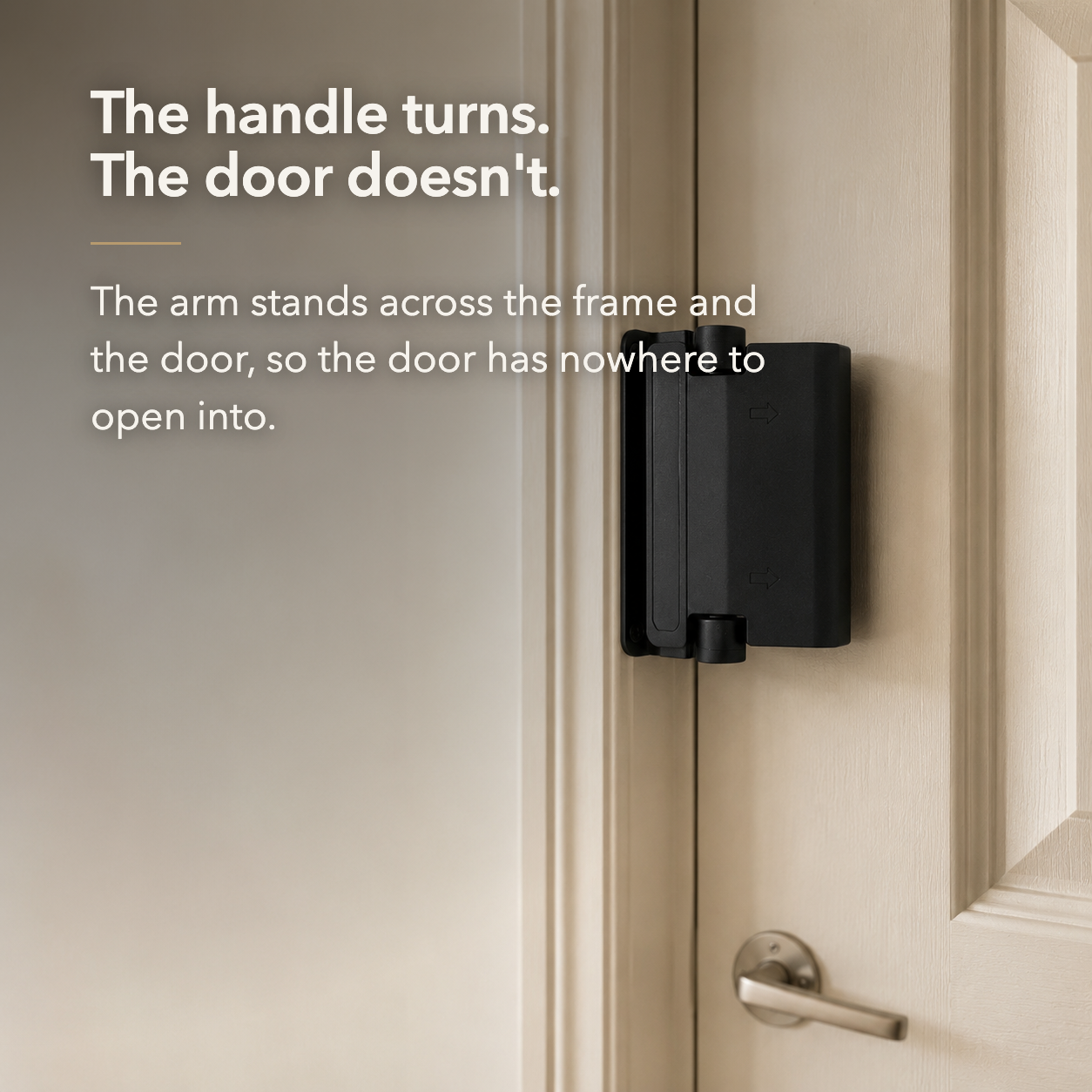 The handle turns, the door doesn't - the arm stands across the frame and the door