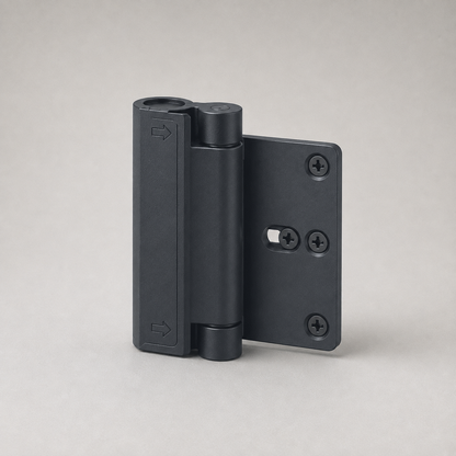 Matte black childproof door lock on a plain grey studio background