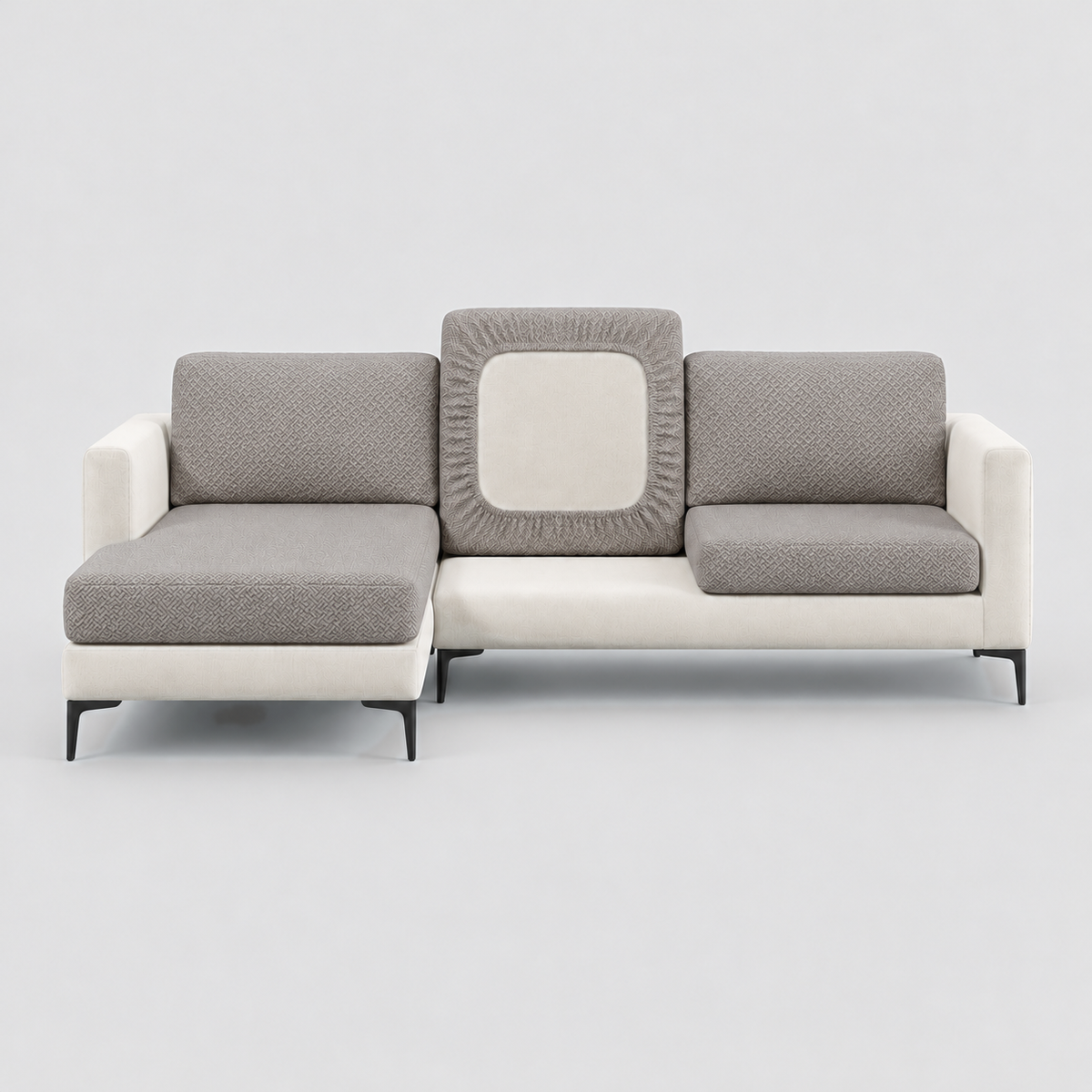 Cream L-shaped sofa face-on with taupe stretch cushion covers, one back cushion turned to show the elastic underside