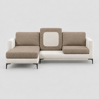 Cream L-shaped sofa face-on with camel stretch cushion covers, one back cushion turned to show the elastic underside