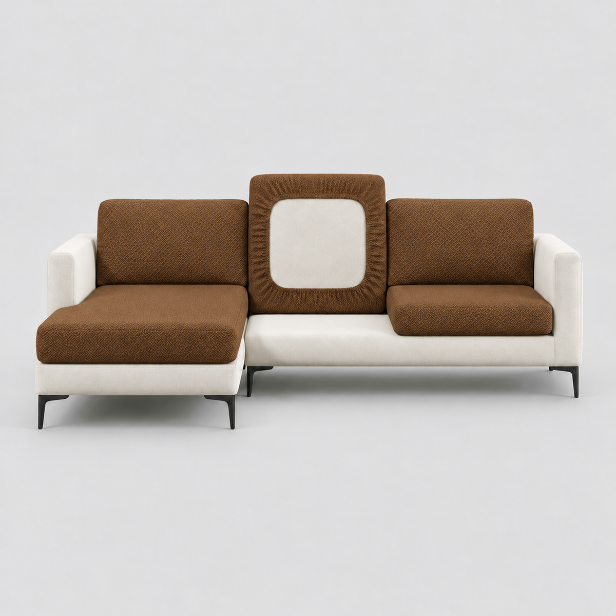 Cream L-shaped sofa face-on with brown stretch cushion covers, one back cushion turned to show the elastic underside