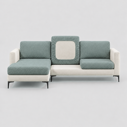 Cream L-shaped sofa face-on with green stretch cushion covers, one back cushion turned to show the elastic underside