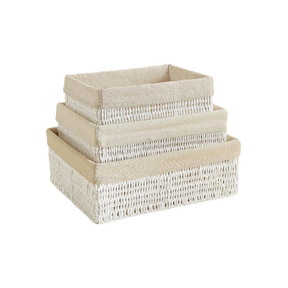Small, medium and large white woven bins with beige fabric liners, stacked one inside the next on a white background