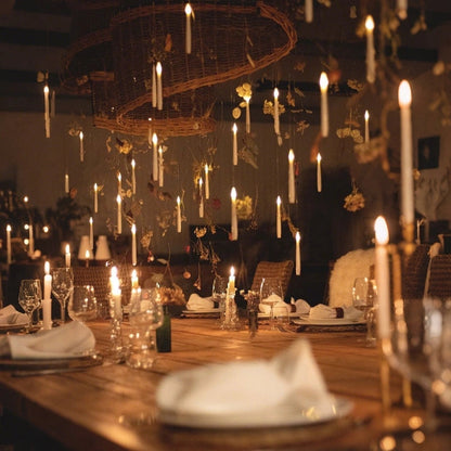 Floating LED candles hung around a wicker ring above a rustic table
