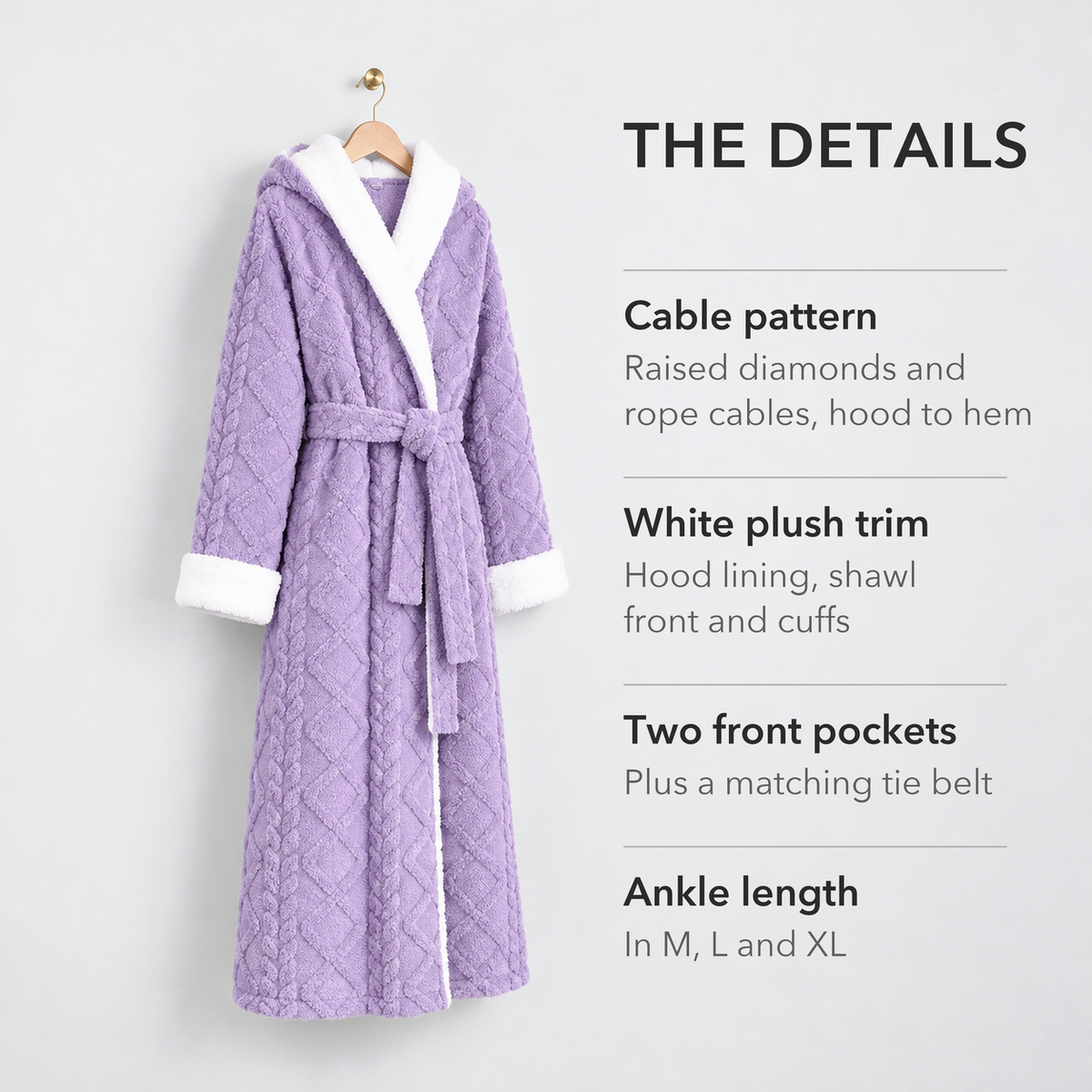 Purple hooded plush bathrobe on a hanger with notes on its raised cable pattern, white plush trim, two front pockets and ankle length