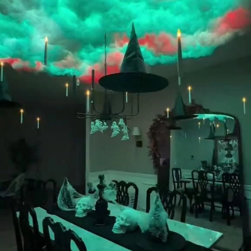 Floating LED candles at the ceiling of a dining room dressed for Halloween