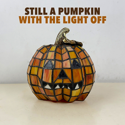 Mosaic pumpkin lamp switched off in daylight with the words Still a pumpkin with the light off