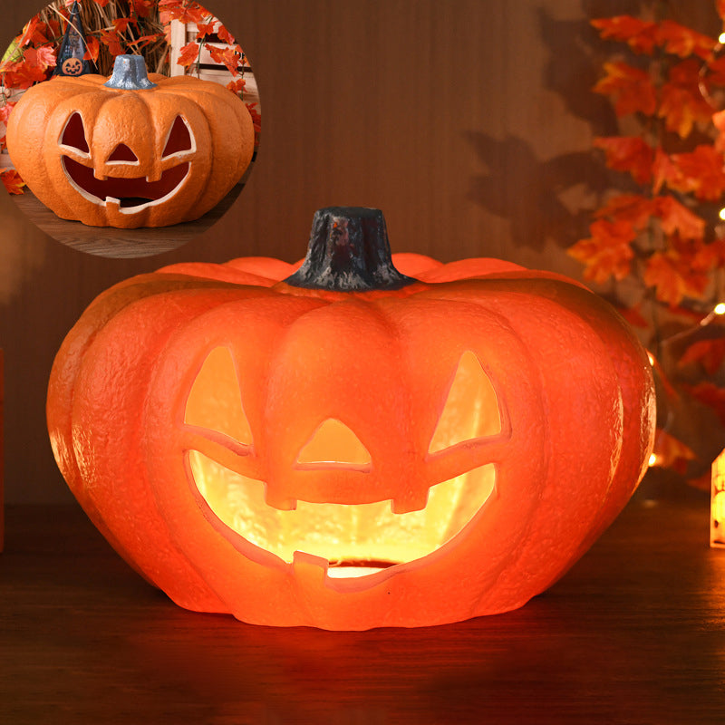 Wide Smile carved pumpkin lamp, low and wide with a textured skin, glowing through triangle eyes and a broad smile