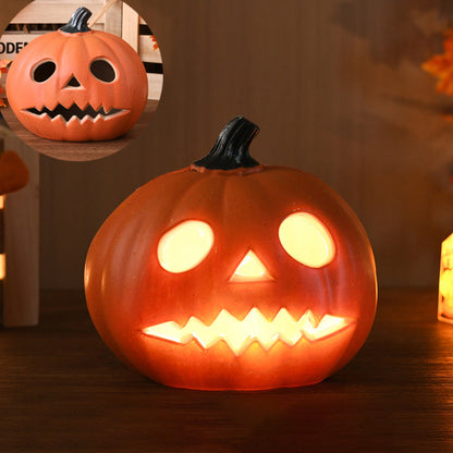 Round Eyes carved pumpkin lamp, a small pumpkin lit with two oval eyes and a zigzag mouth