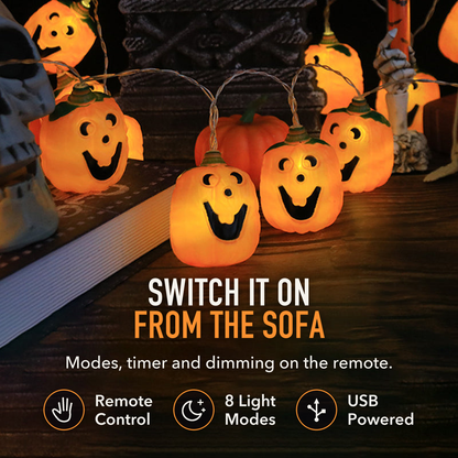 Jack-o'-lantern string lights on a dark tabletop with the words Switch It On From the Sofa, Remote Control, 8 Light Modes and USB Powered