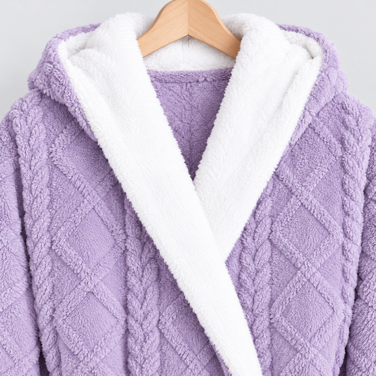 Close-up of the white-lined hood and white shawl front on the purple bathrobe