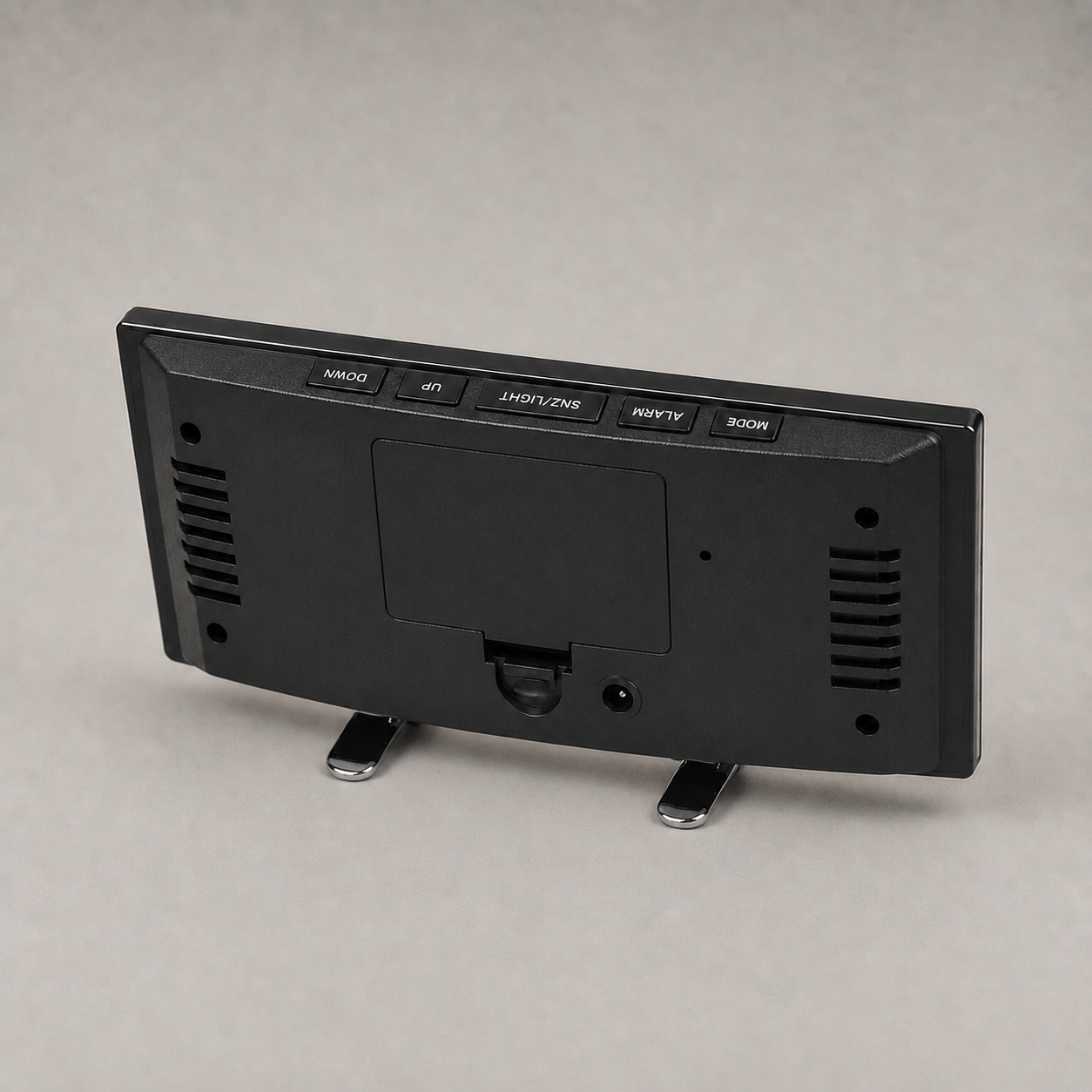 Rear of the clock showing the controls, battery hatch and USB port