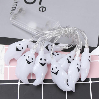 Close view of the ghost pendants and the slim clear battery box with its slide switch