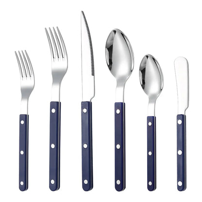 Navy handled six piece set, knife, fork, small fork, spoon, teaspoon and butter knife, laid out on white