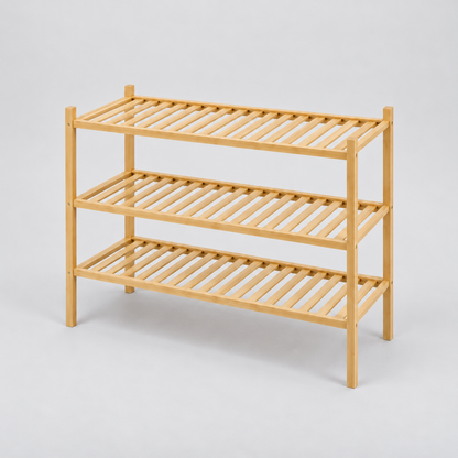 Empty 3 tier bamboo shoe rack with slim square posts and slatted shelves on a light grey background