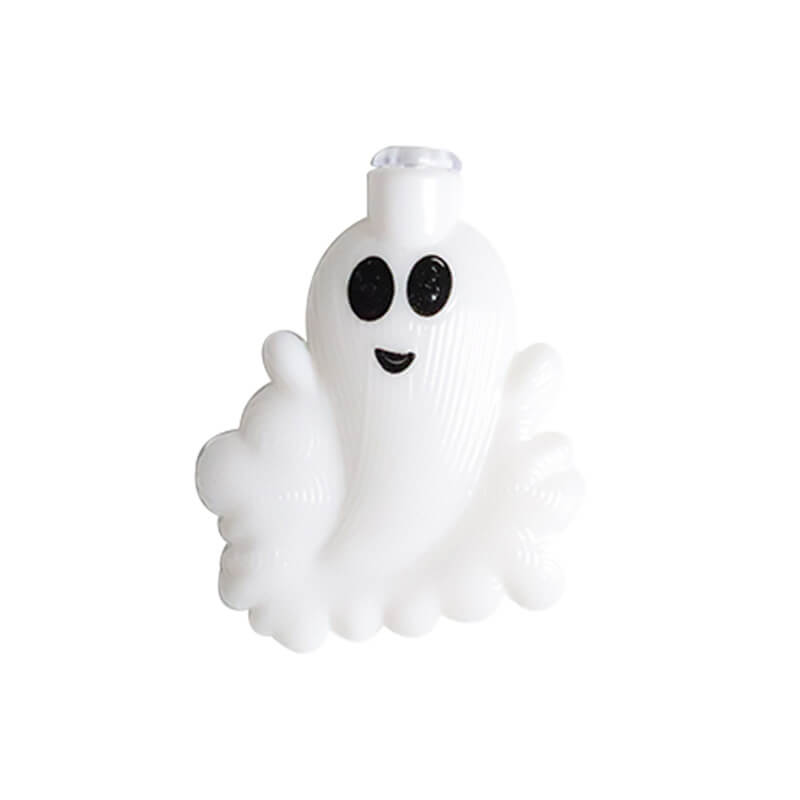 One white ghost from the string lights, switched off, with two black eyes, a small smile and a raised arm