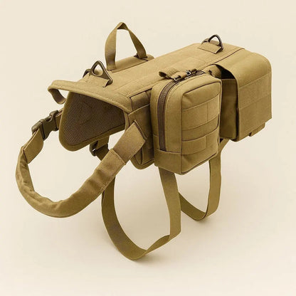 Tan dog harness vest with a saddle pouch on each side, a zipped box pouch on one, a grab handle and two leash rings, on a plain background