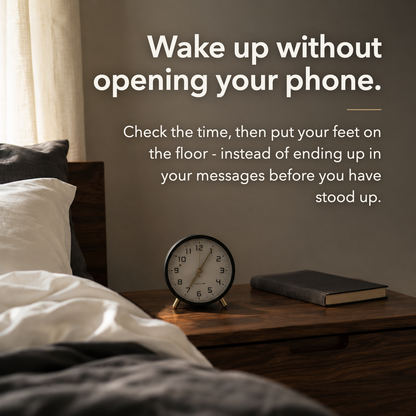 Bedroom in morning light with the black alarm clock on the nightstand and no phone. Text reads: Wake up without opening your phone.