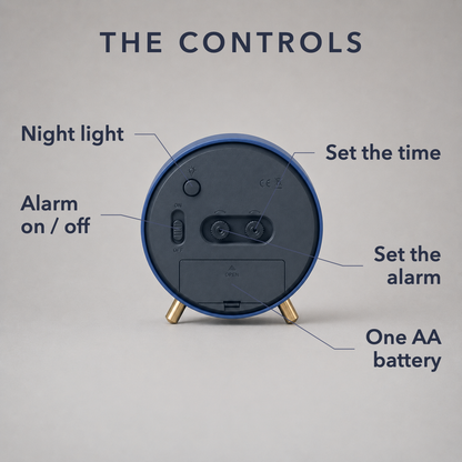 Labelled diagram of the back of the clock showing the night light button, alarm on and off slider, time and alarm setting wheels and the AA battery hatch